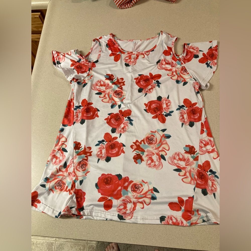 Cold shoulder white with pinkish orange flowers blouse. The size is large.